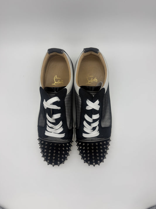 Top-down view of both sneakers showing the full gunmetal spike toe caps and white laces
