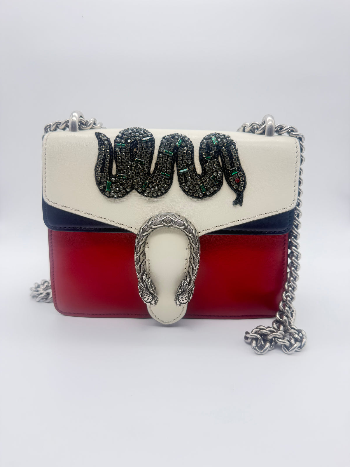 Gucci Dionysus Mini in red, navy and ivory calfskin, front view with the crystal snake embroidery and aged silver tiger-head closure