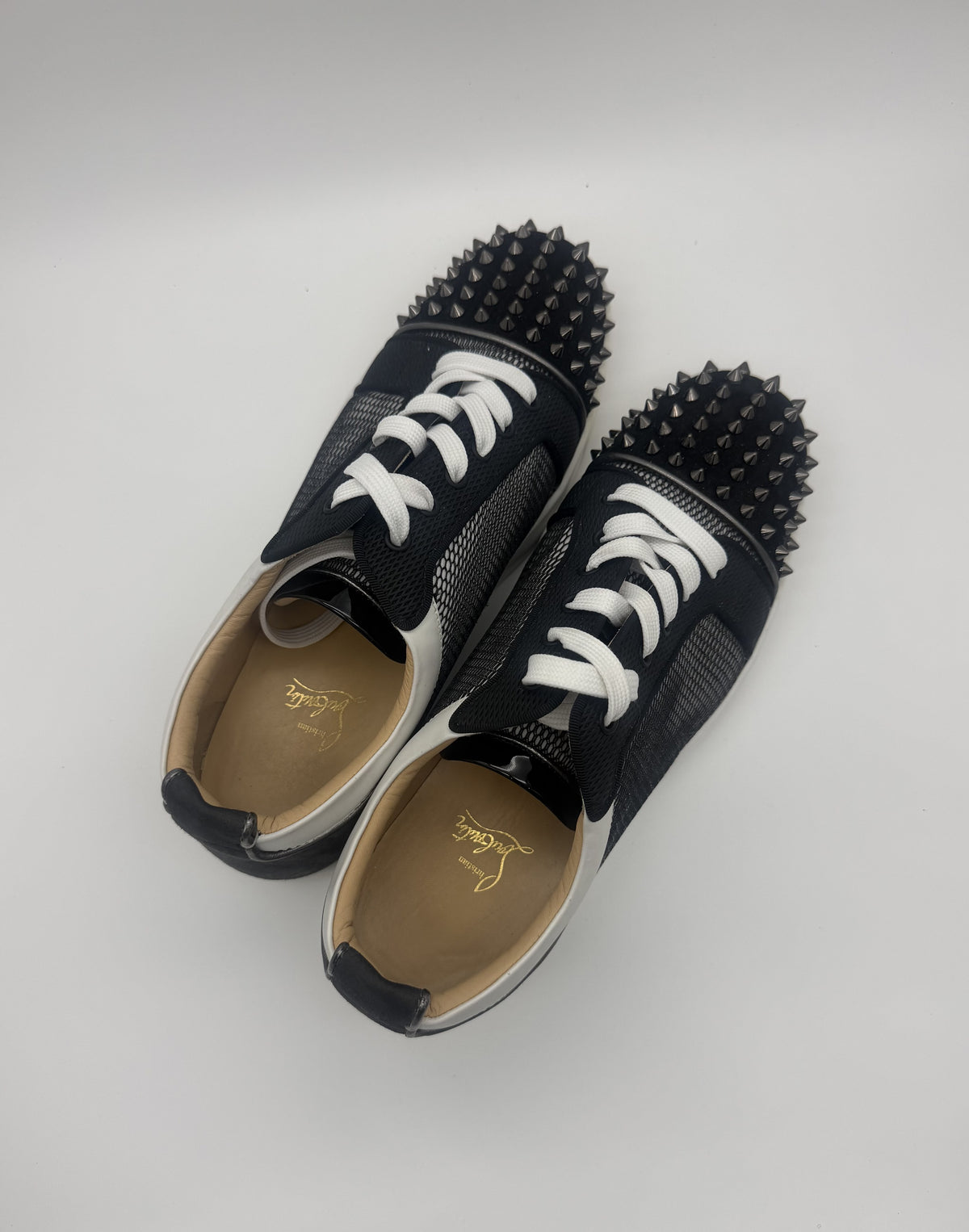 Three-quarter view showing the mesh, suede and white leather trim with the tan leather insoles