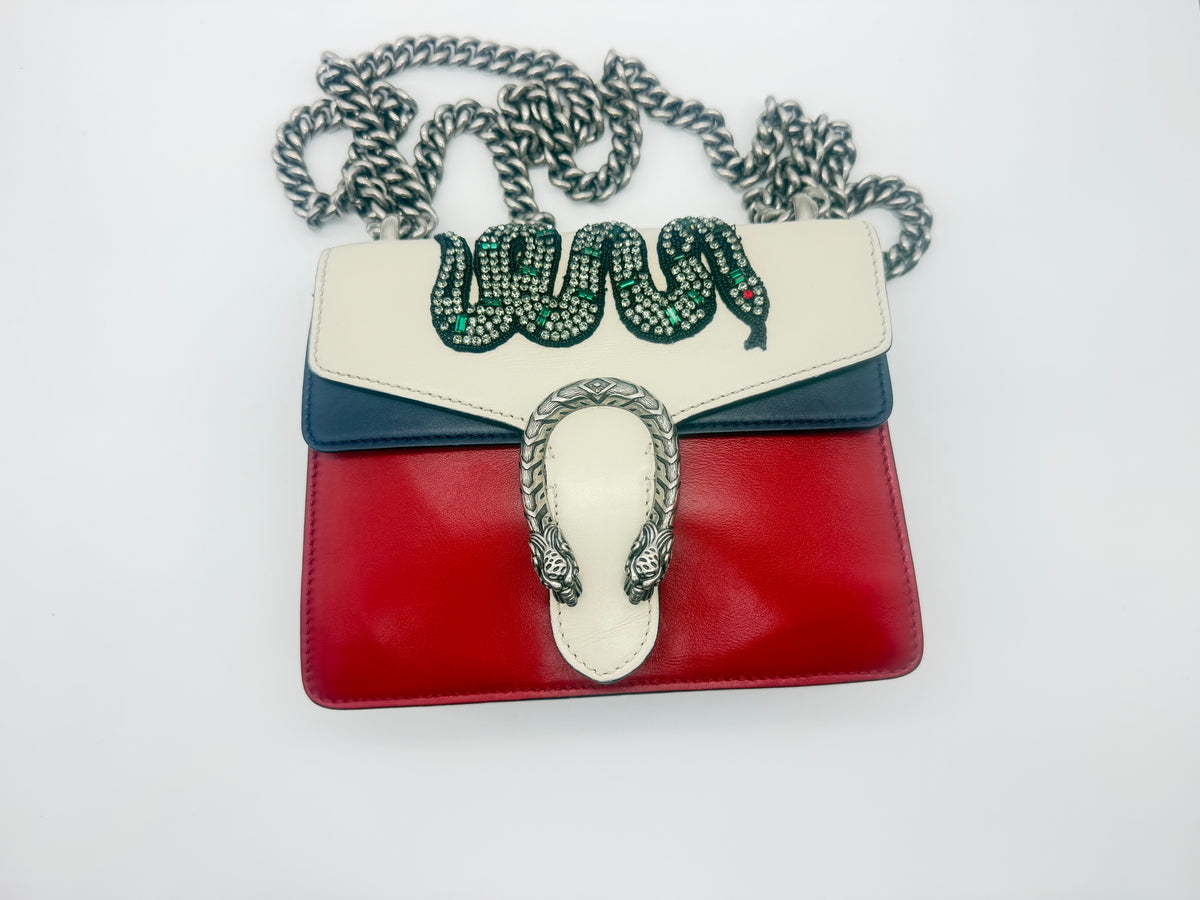 Front of the bag with the sliding chain shoulder strap laid out