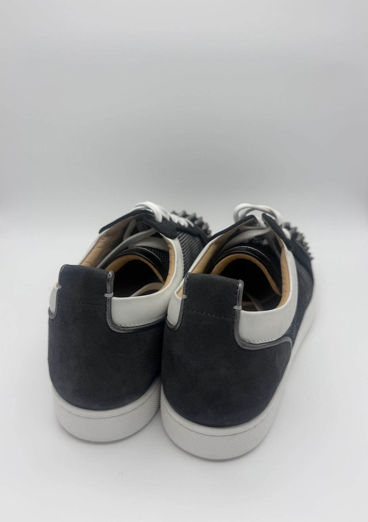 Rear view showing the suede heel counters and white leather trim
