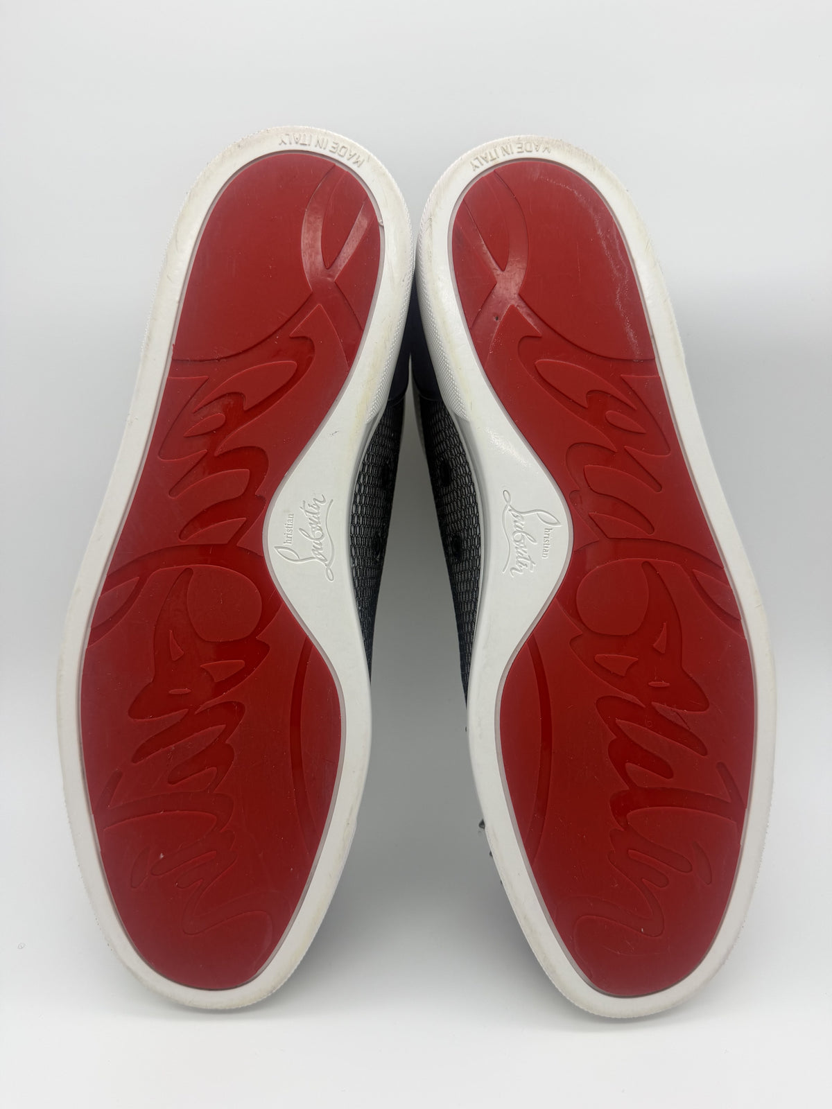 Red rubber outsoles with the embossed Christian Louboutin script and Made in Italy