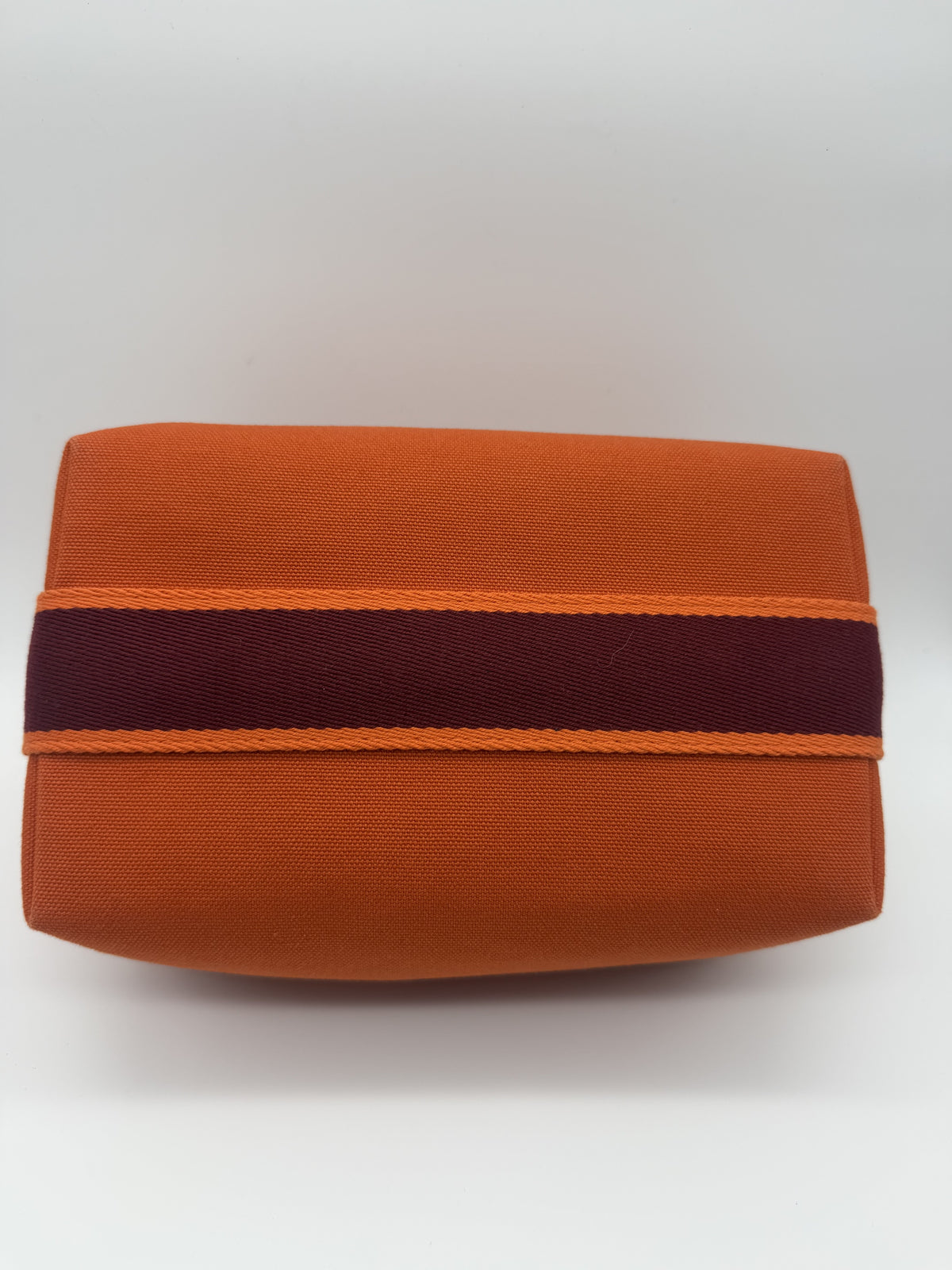 Front with the strap unsnapped, showing the full-length zip and leather pull