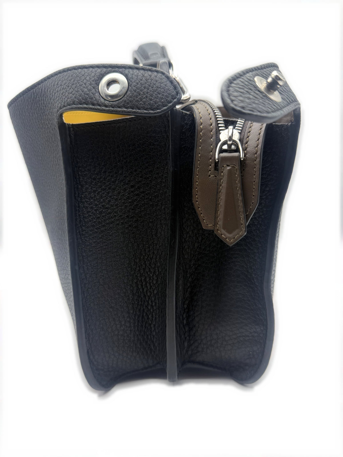 Side profile with the gusset open, showing the yellow interior and the compartment divider