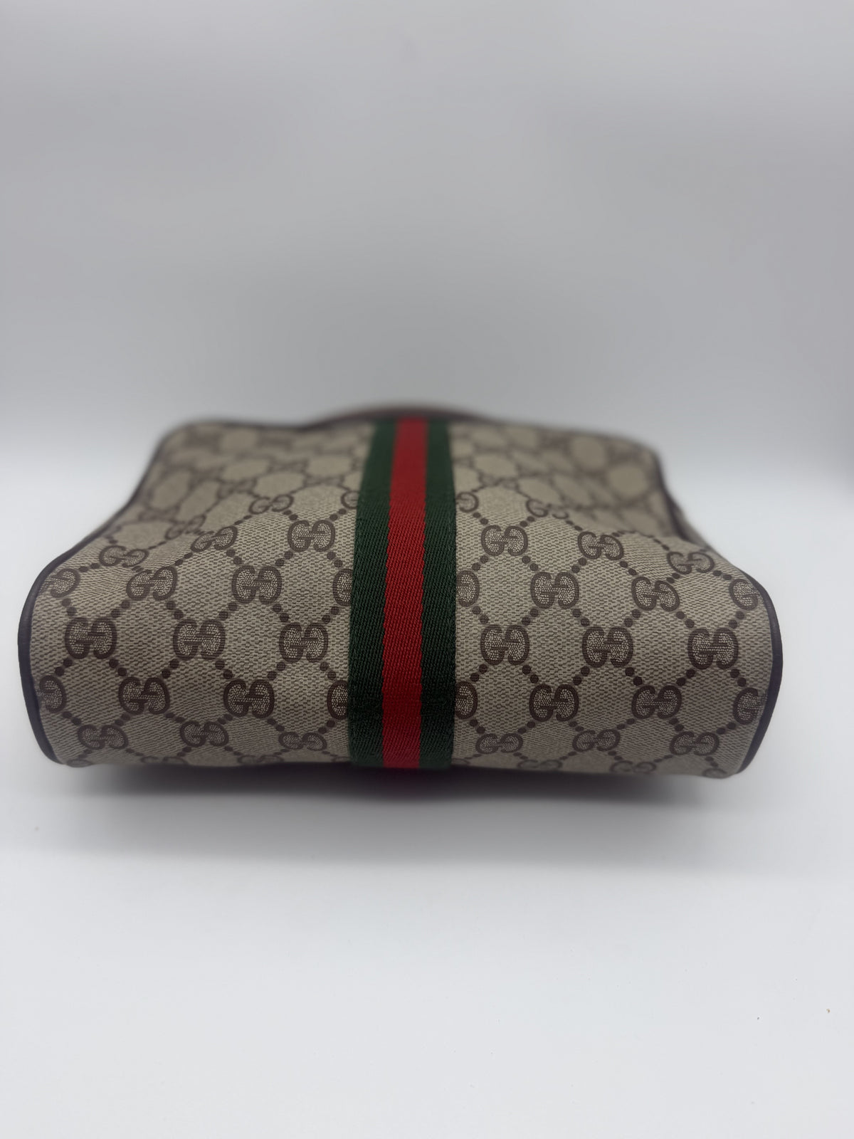 Low angle across the front, showing the web stripe and brown leather piping