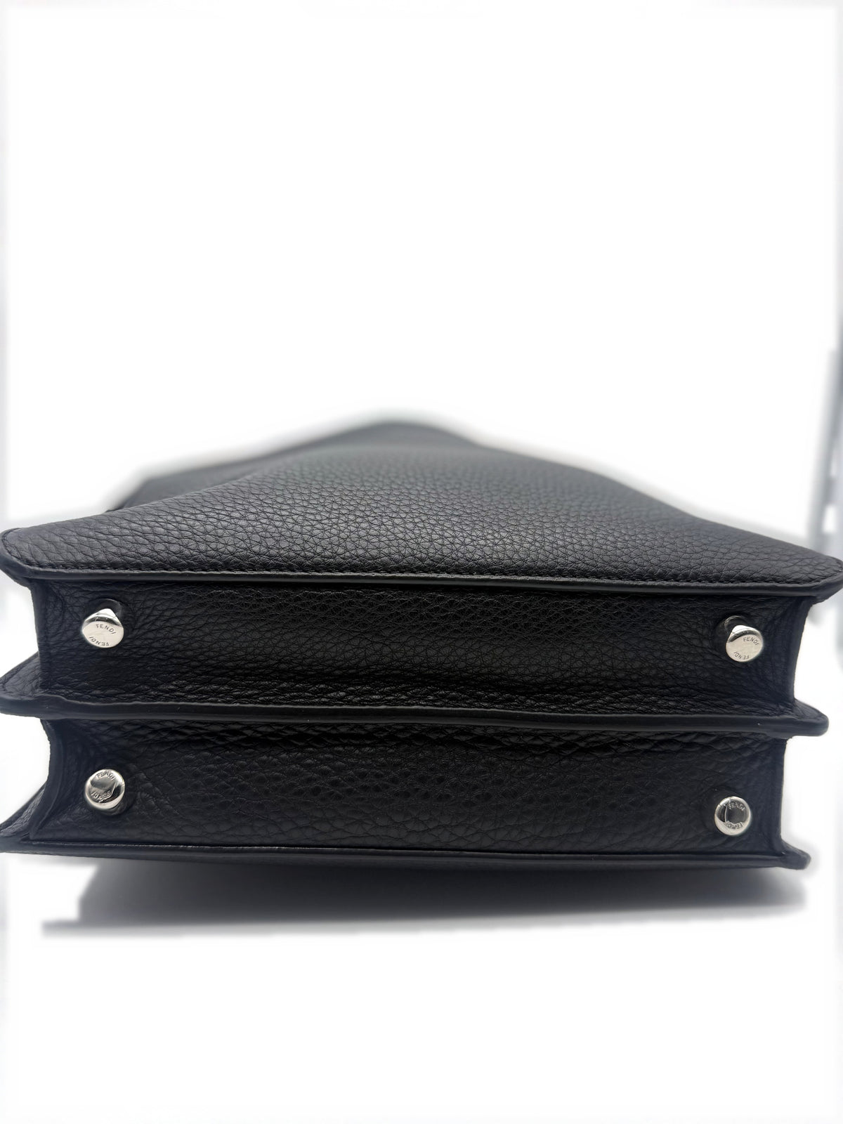 Base of the bag showing the four protective metal studs and the corners