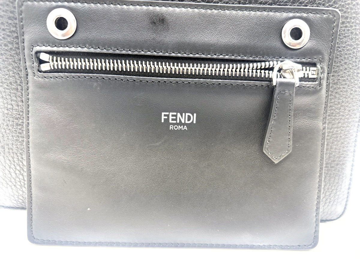 The detachable flat pouch embossed FENDI ROMA that ships with the bag